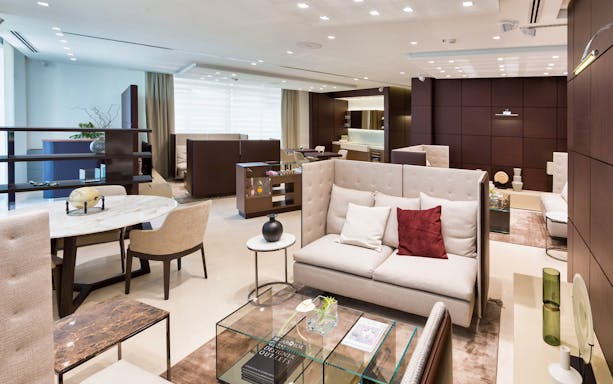 Luxurious lounge area at Serravalle Designer Outlet with modern seating and decor.