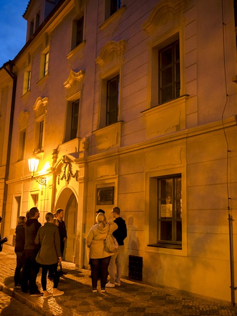 Group on Prague evening tour exploring Old Town legends.