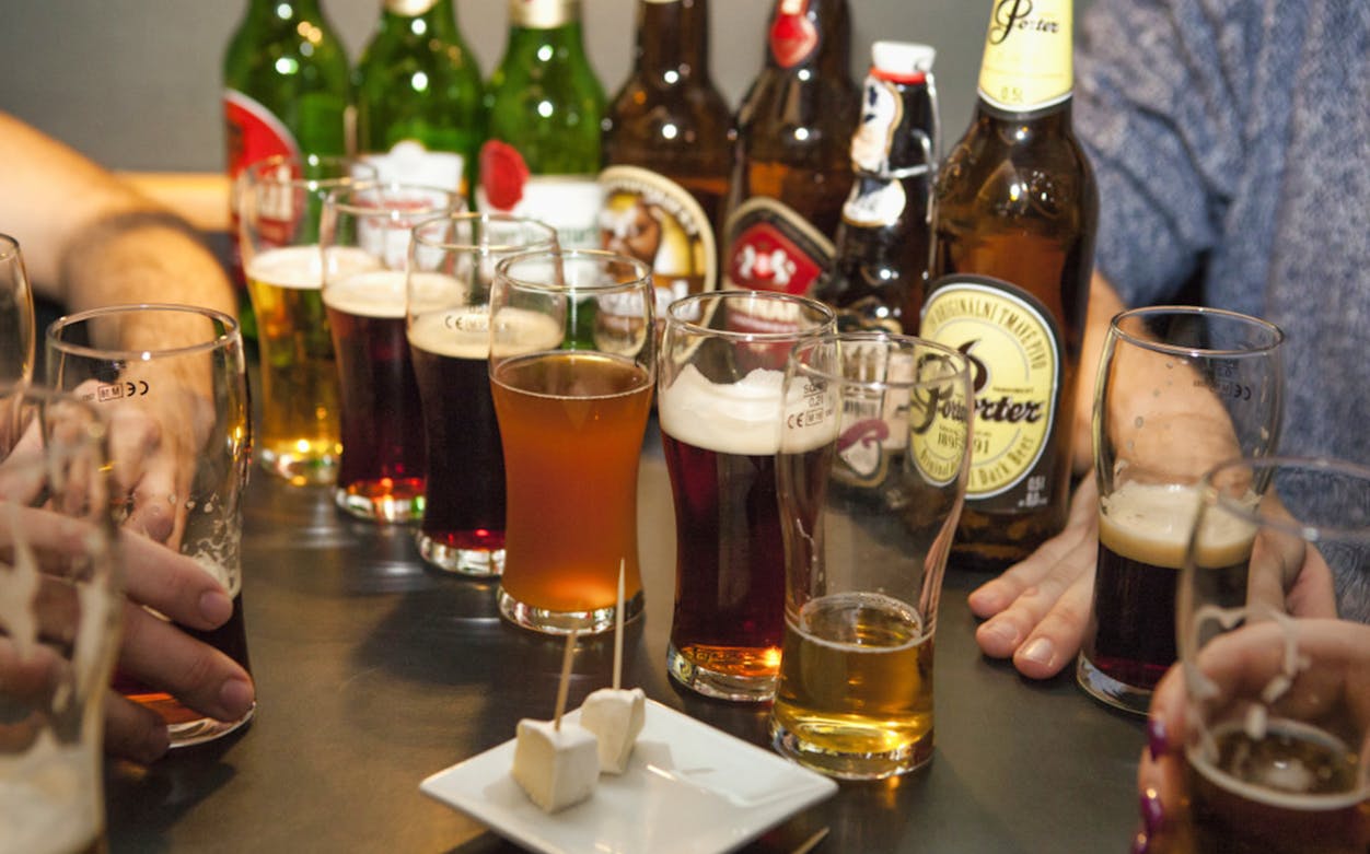 Czech beer tasting with various glasses and traditional snacks in Prague.