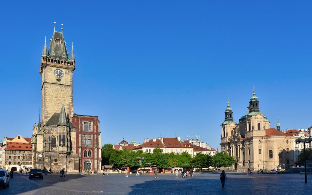 Astronomical Clock tower and surrounding buildings in Prague's Old Town Square.