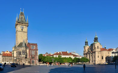 Astronomical Clock tower and surrounding buildings in Prague's Old Town Square.