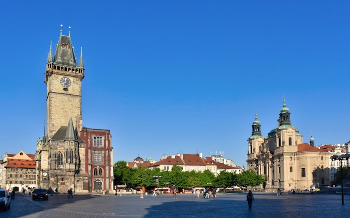 Astronomical Clock tower and surrounding buildings in Prague's Old Town Square.