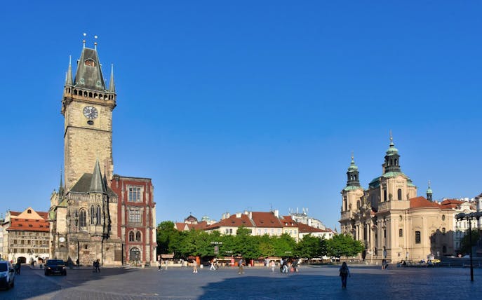 Astronomical Clock tower and surrounding buildings in Prague's Old Town Square.