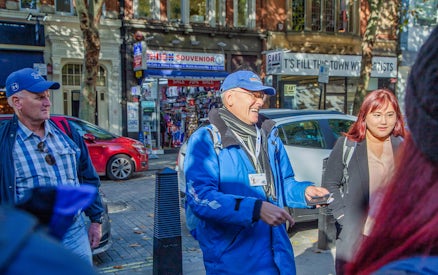 Tour guide leading a group on the Royal Walking Tour, Changing of the Guard in London.