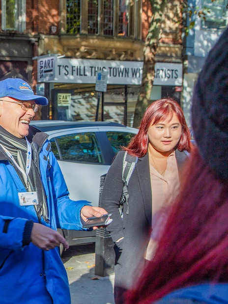 Tour guide leading a group on the Royal Walking Tour, Changing of the Guard in London.
