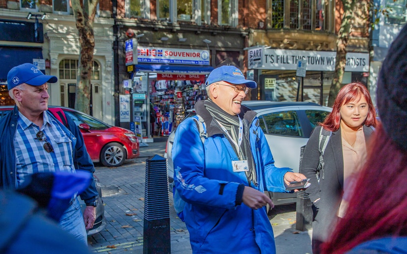 Tour guide leading a group on the Royal Walking Tour, Changing of the Guard in London.