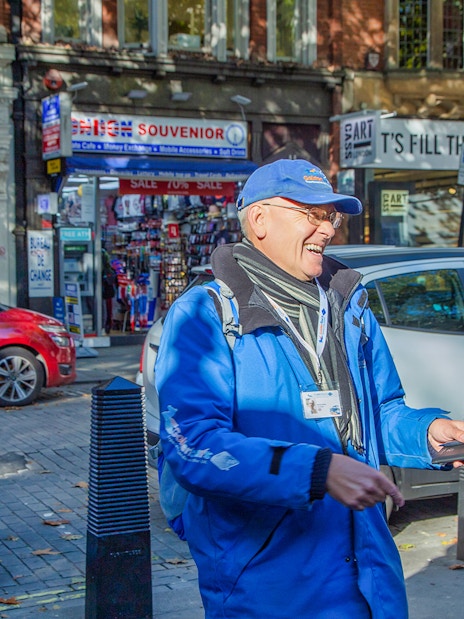 Tour guide leading a group on the Royal Walking Tour, Changing of the Guard in London.
