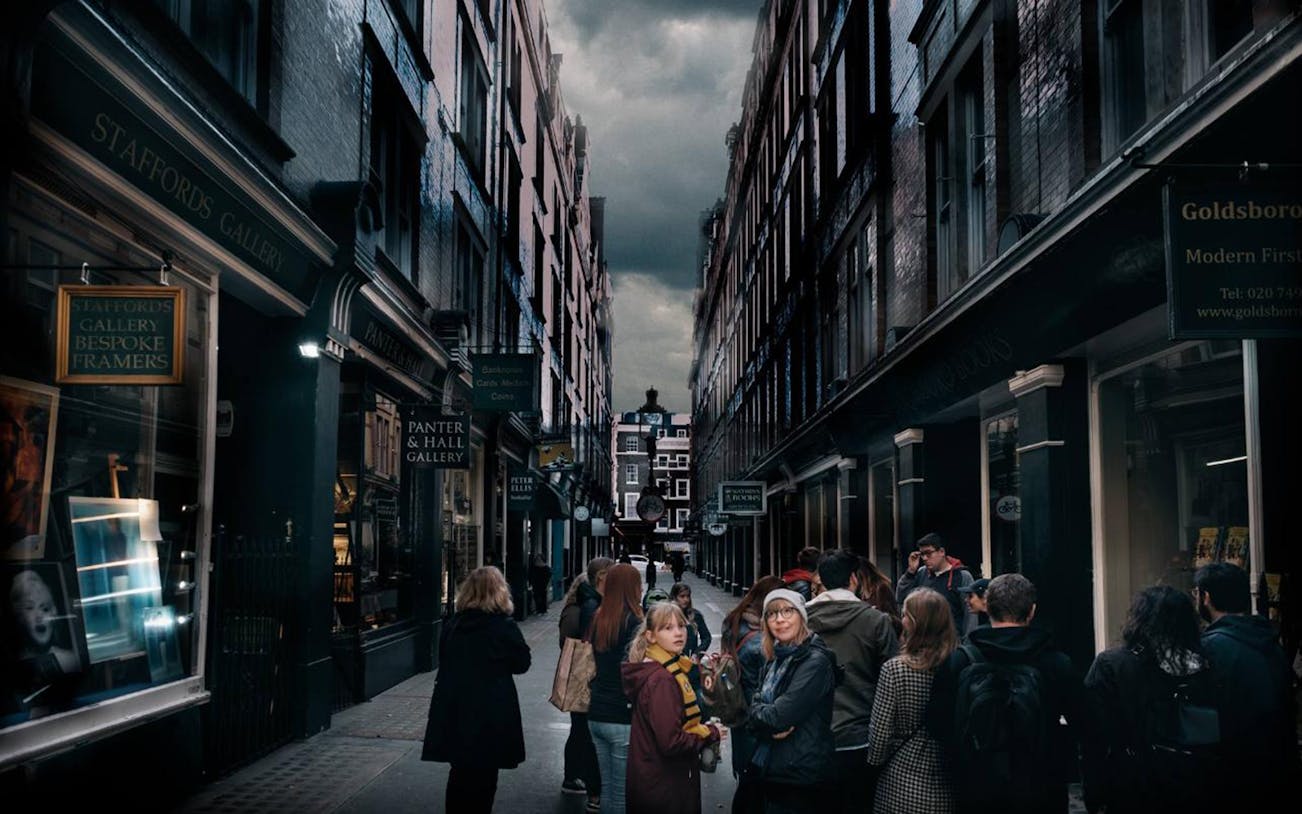 Group of tourists exploring a narrow London alley, part of The Magic of Film Experience.