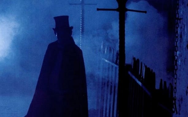Silhouette of a figure in a top hat on a foggy London street, Jack The Ripper & Haunted London Tour.