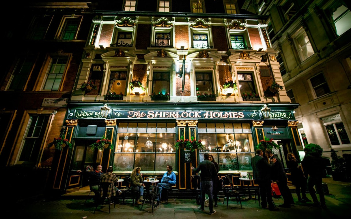 Sherlock Holmes pub exterior at night, part of Jack The Ripper & Haunted London Tour.