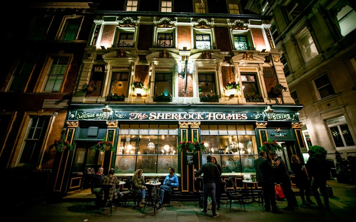Sherlock Holmes pub exterior at night, part of Jack The Ripper & Haunted London Tour.
