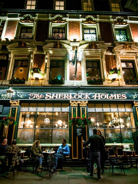 Sherlock Holmes pub exterior at night, part of Jack The Ripper & Haunted London Tour.