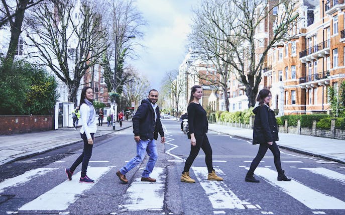 People crossing Abbey Road in London on The Beatles Walking Tour.