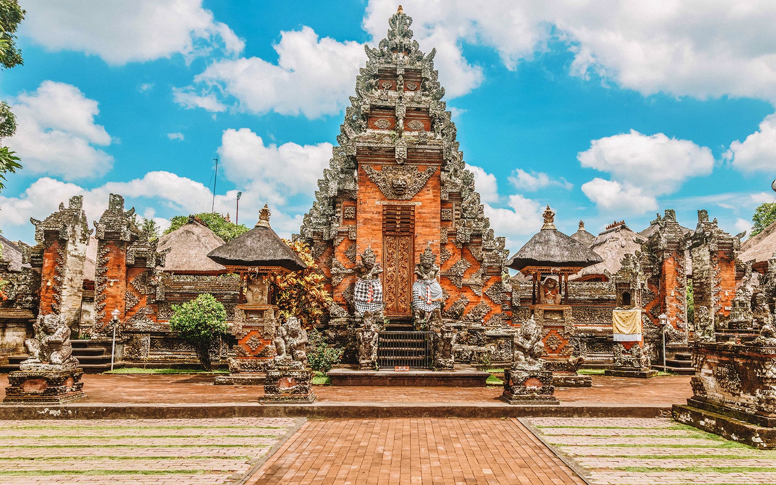 Balinese temple architecture at Goa Gajah, Ubud, with intricate stone carvings.