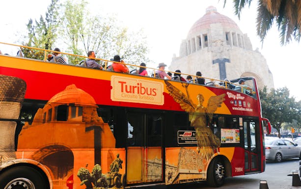Turibus bus in front of the Monument to the Revolution, Mexico City.