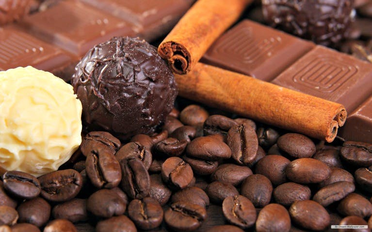 Assorted chocolates, coffee beans, and cinnamon sticks at Chocolate Kingdom.