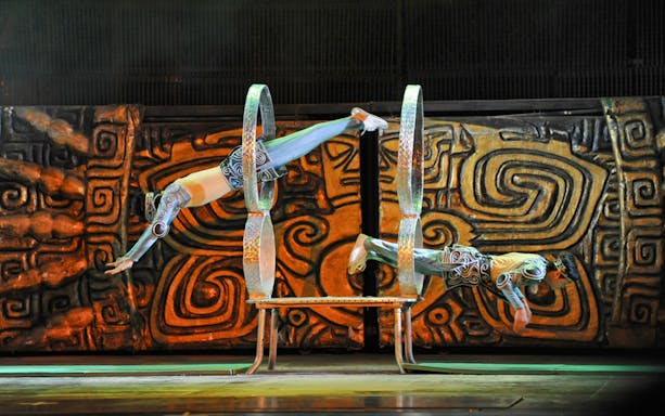 Acrobats performing through hoops at Beijing Chaoyang Theatre.