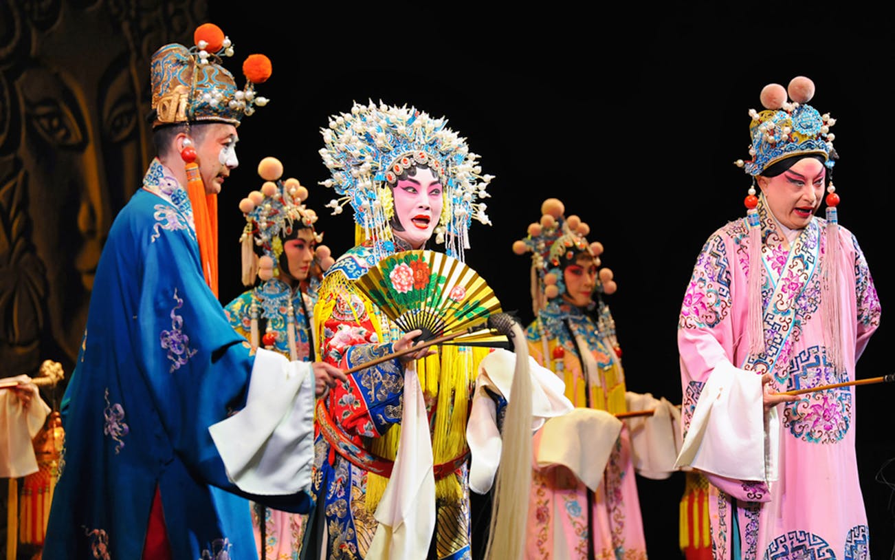 Performers in traditional costumes at Peking Opera, Beijing Liyuan Theatre.