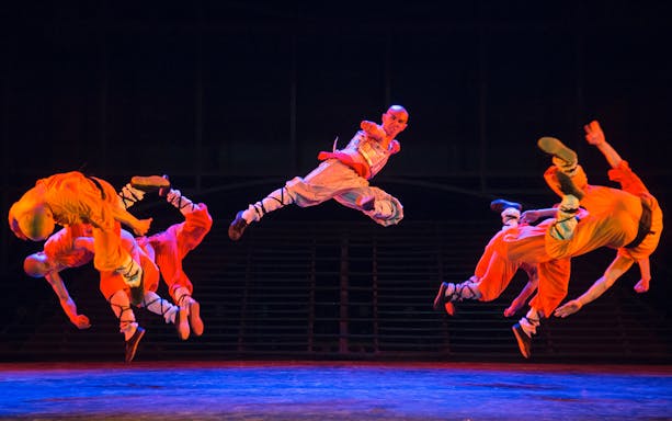 Shaolin monks performing acrobatic kungfu moves at Beijing Red Theatre.