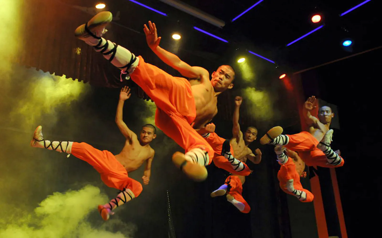 Shaolin monks performing martial arts during a Beijing Kungfu show.