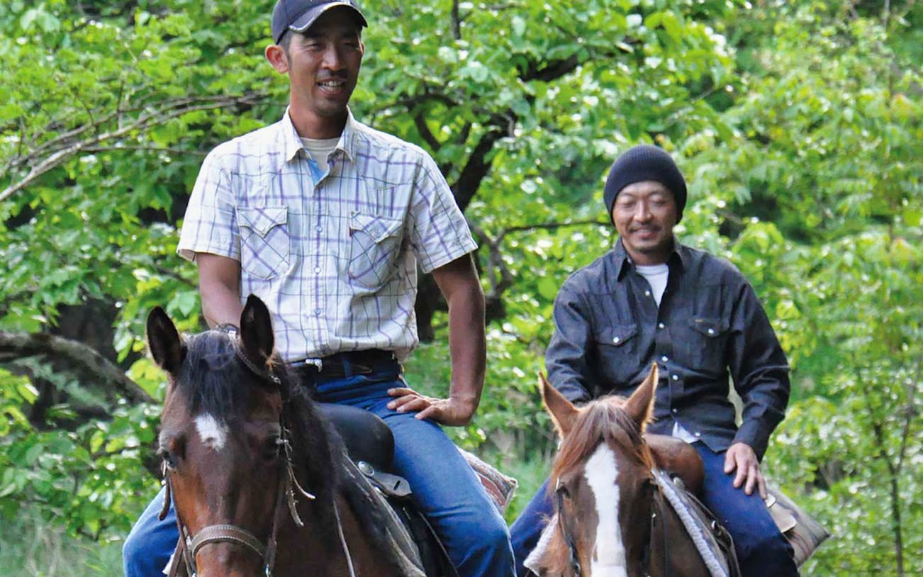 Horse riding through lush greenery in Kyoto, Japan.