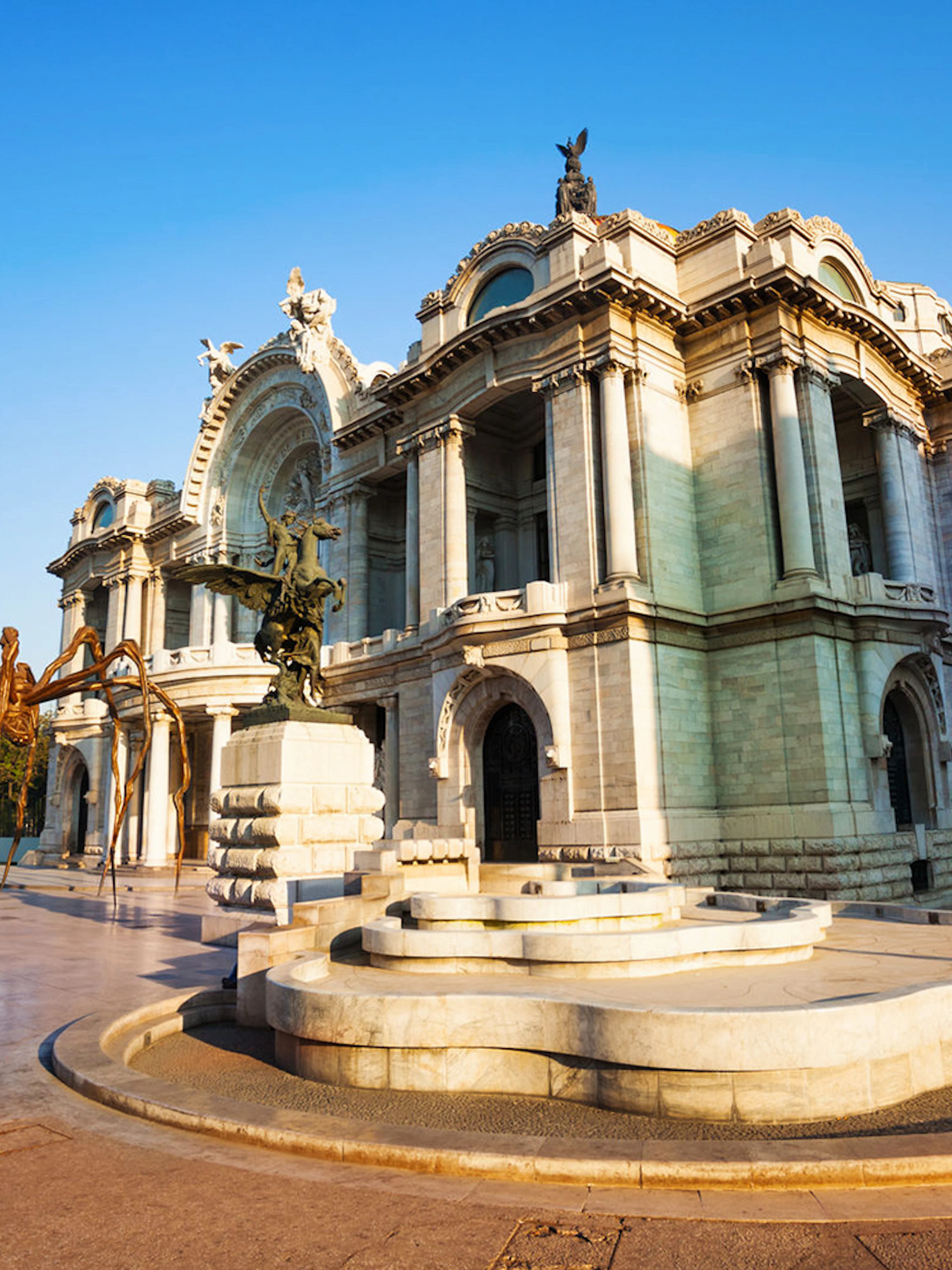 Bellas Artes Palace in Mexico City with outdoor sculpture.