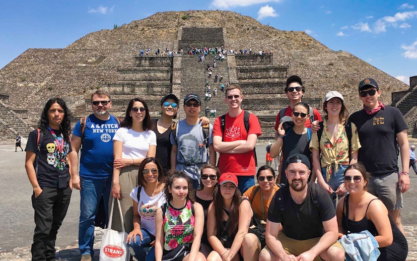 Group of tourists in front of Teotihuacán Pyramid during early access tour.