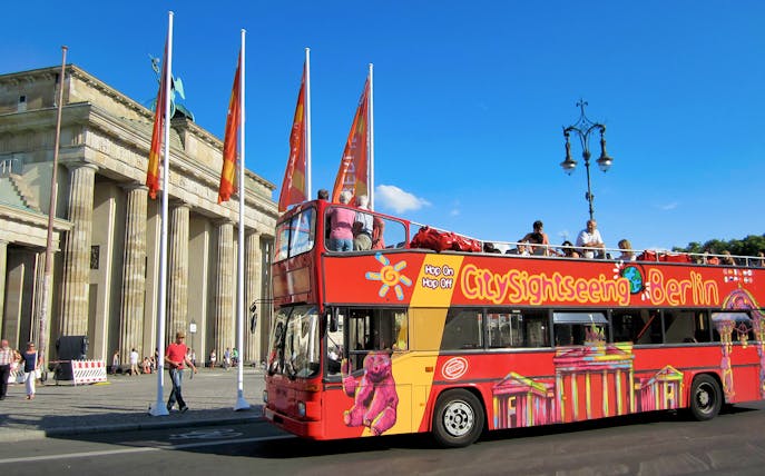 Open-top sightseeing bus near Brandenburg Gate, Berlin.