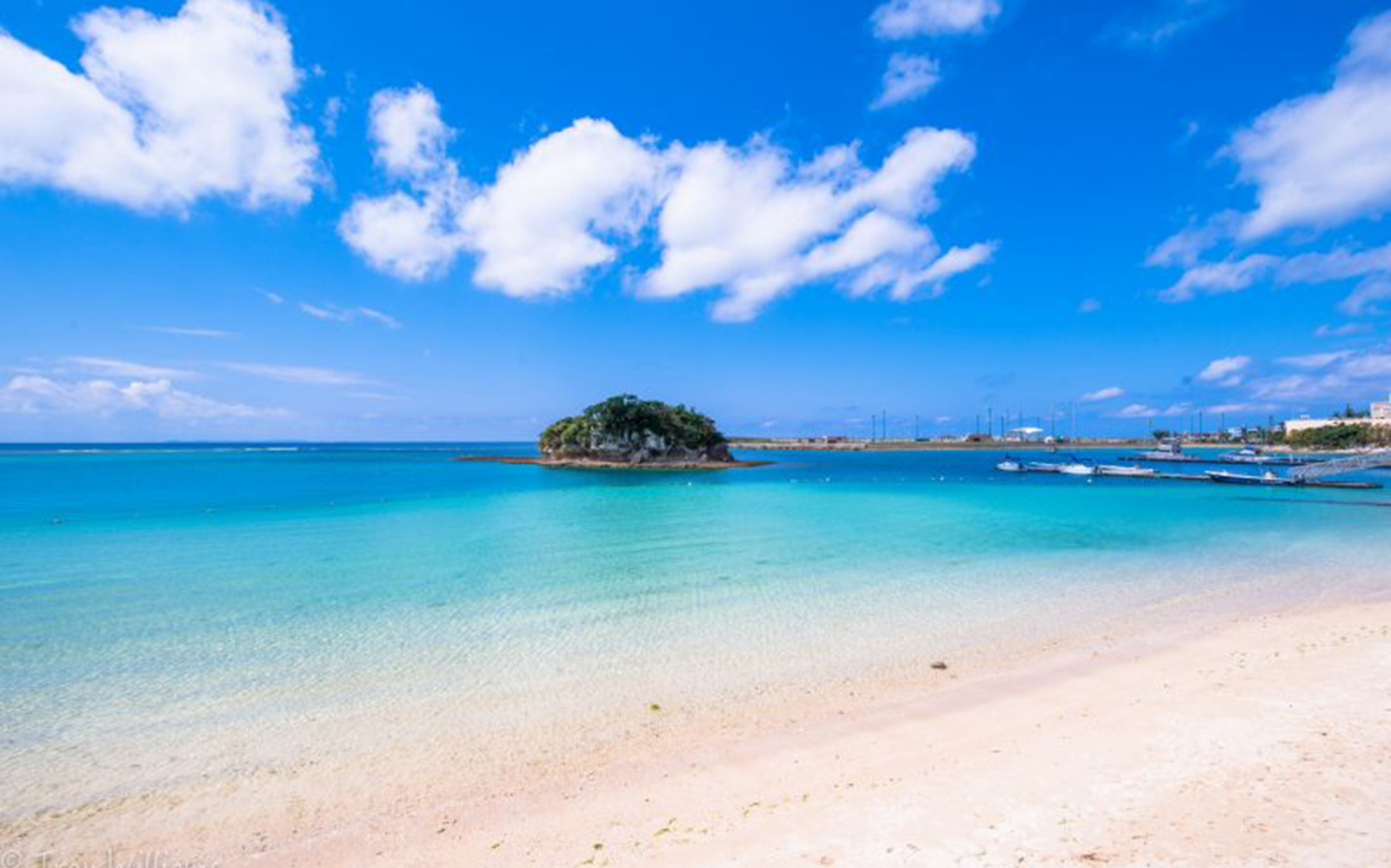 Chatan Town beach with clear blue sea and small island, Okinawa.