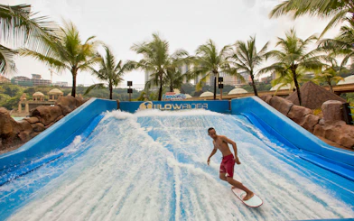 Surfer on FlowRider at Sunway Lagoon Theme Park, Malaysia.