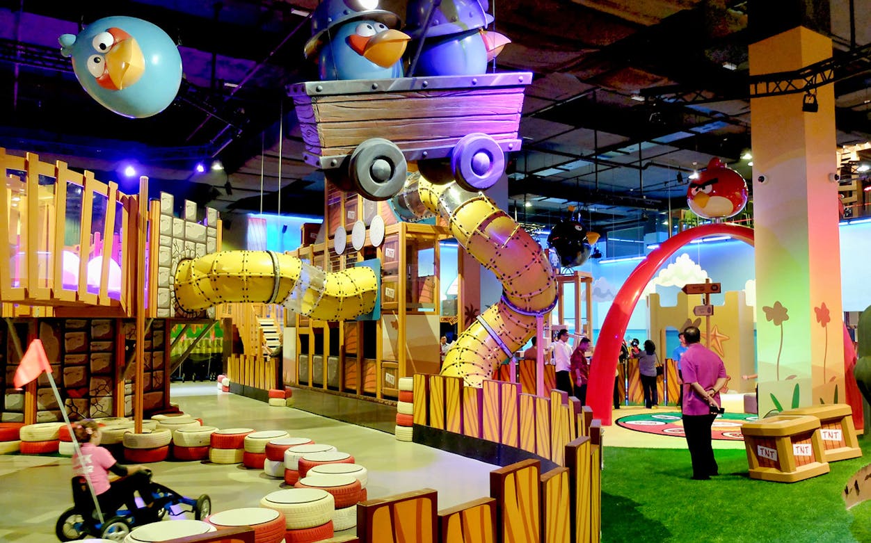 Indoor play area at Angry Birds Activity Park with themed structures and children playing.