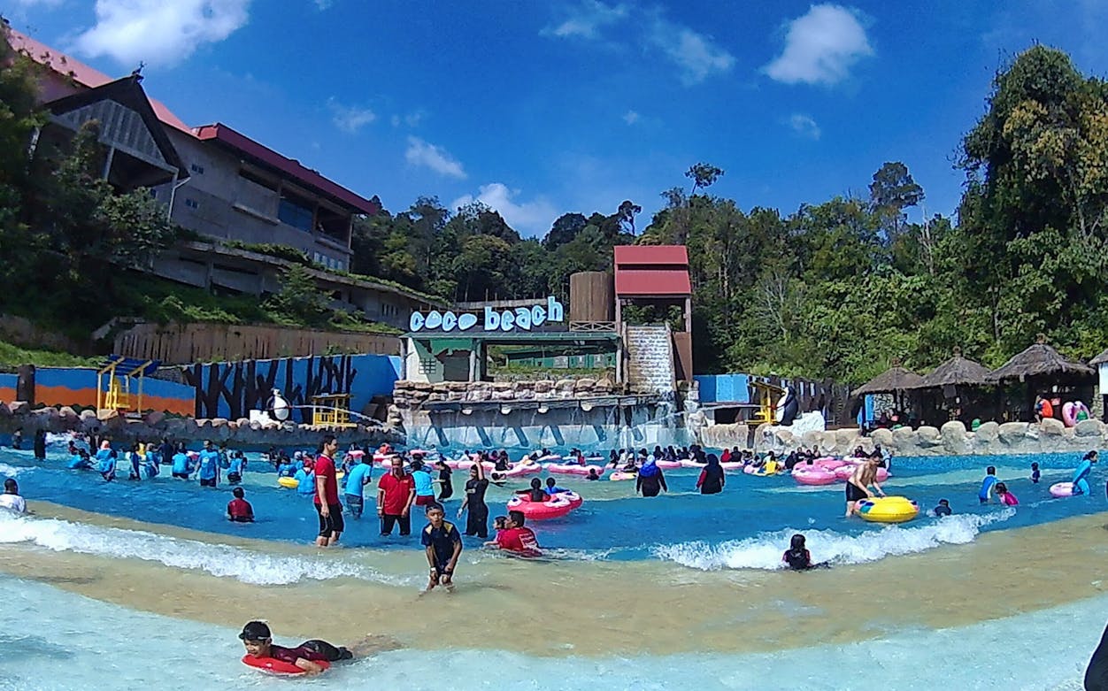 Visitors enjoying the wave pool at Bukit Gambang Water and Safari Park.