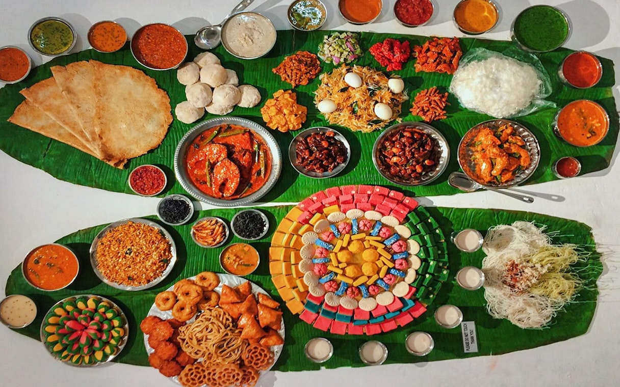 Traditional Malaysian dishes displayed on banana leaves at Wonderfood Museum.
