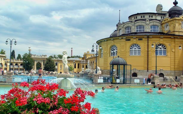 Széchenyi Spa outdoor pool with people swimming, Budapest.