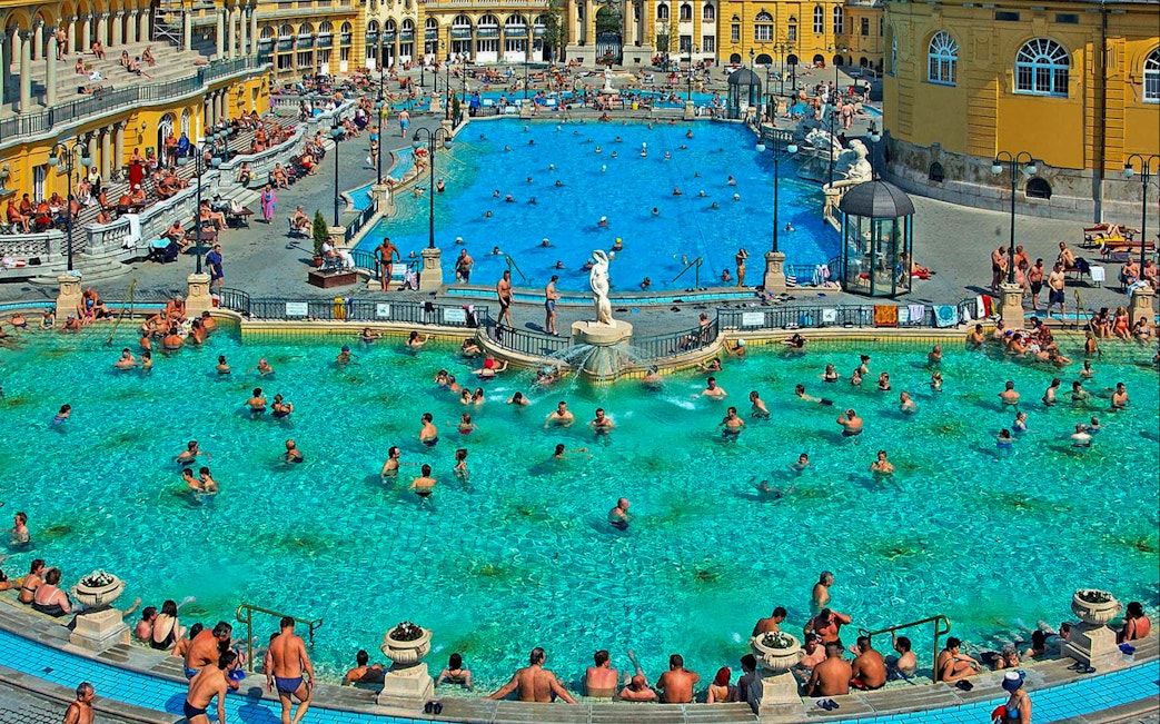 Visitors enjoying thermal pools at Széchenyi Spa, Budapest.