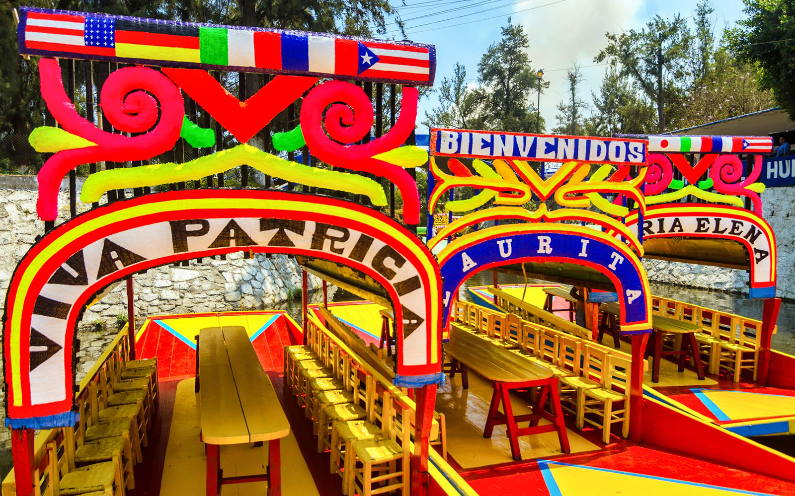 Colorful trajineras in Xochimilco, Mexico City, ready for a guided tour.