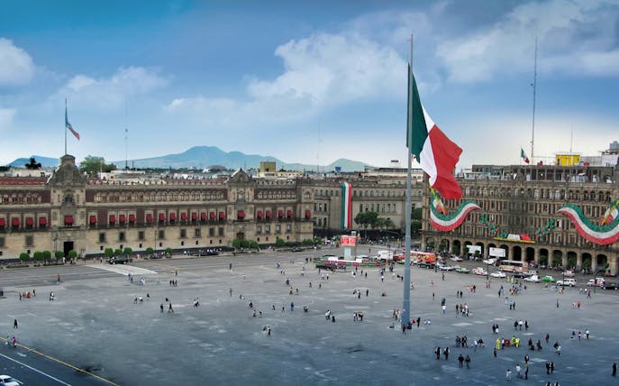 Zócalo square with Mexican flag in Mexico City, part of Xochimilco tour.