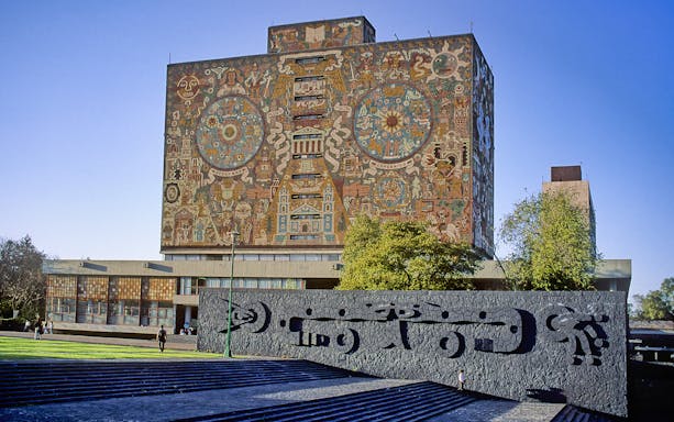 UNAM Central Library with mural in Mexico City on Xochimilco & Coyoacan tour.