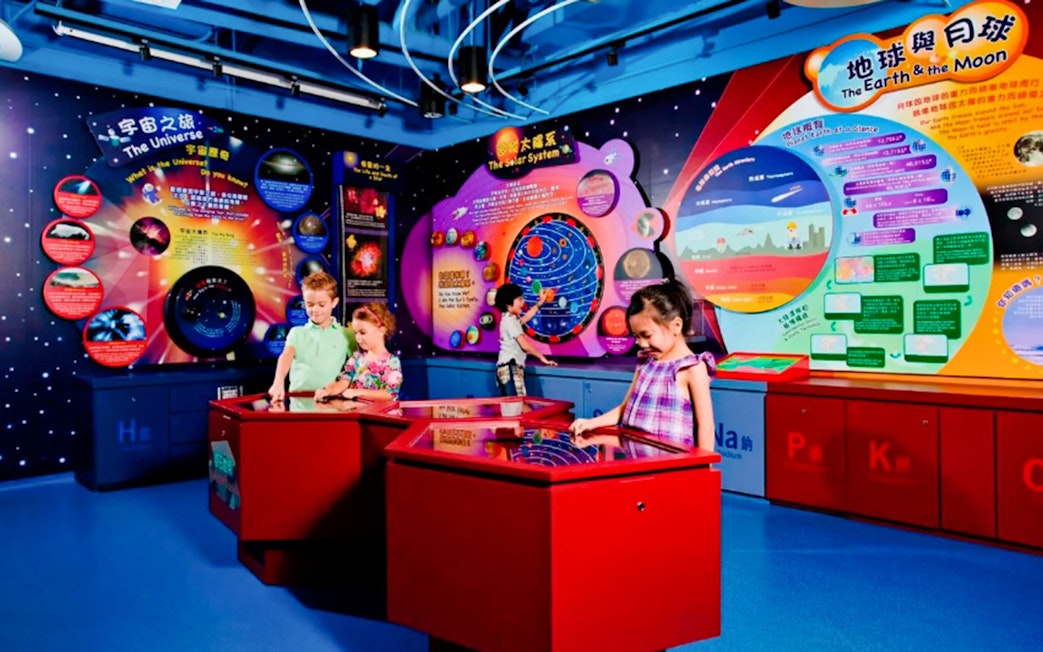 Children exploring interactive exhibits at Noah's Ark Hong Kong science center.