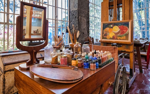 Art supplies and easel in Frida Kahlo Museum studio, Mexico City.