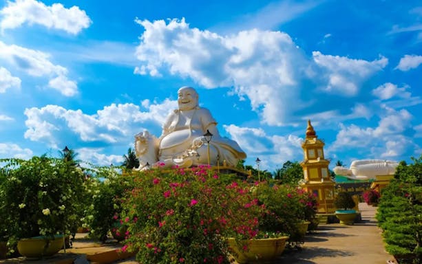 Vinh Trang Pagoda with Buddha statue and gardens, Mekong Delta tour.