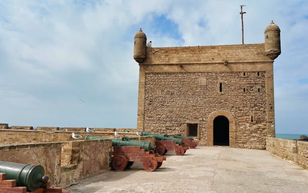 Stone fortress with cannons in Essaouira, Morocco, part of a day trip from Marrakesh.