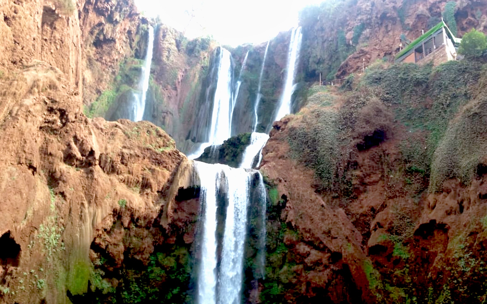 Ouzoud Waterfalls cascading over red cliffs, Marrakesh tour.