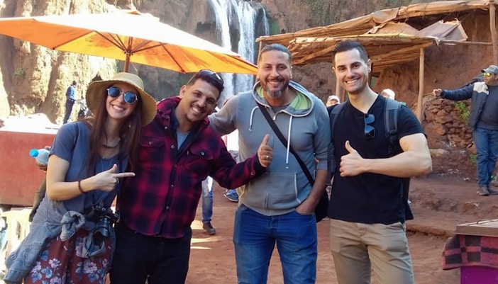 Group of tourists enjoying Ouzoud Waterfalls day tour from Marrakesh.