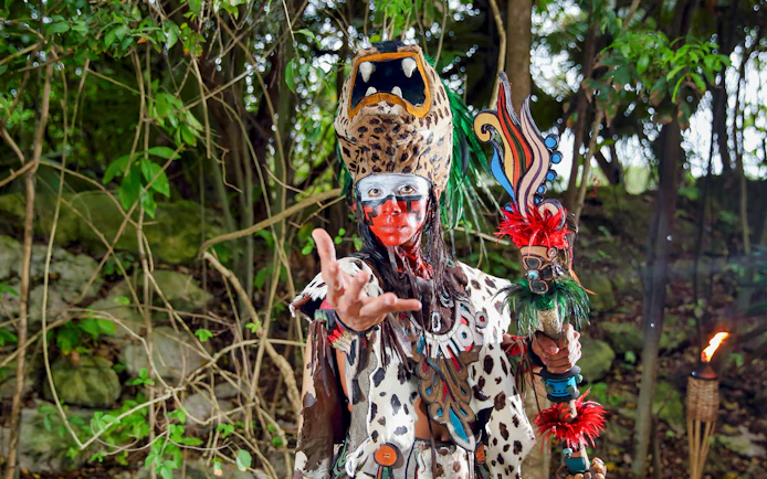 Performer in traditional costume at Xcaret Park, Mexico.