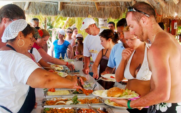 Guests enjoying a buffet on the Premium Isla Mujeres Experience tour.