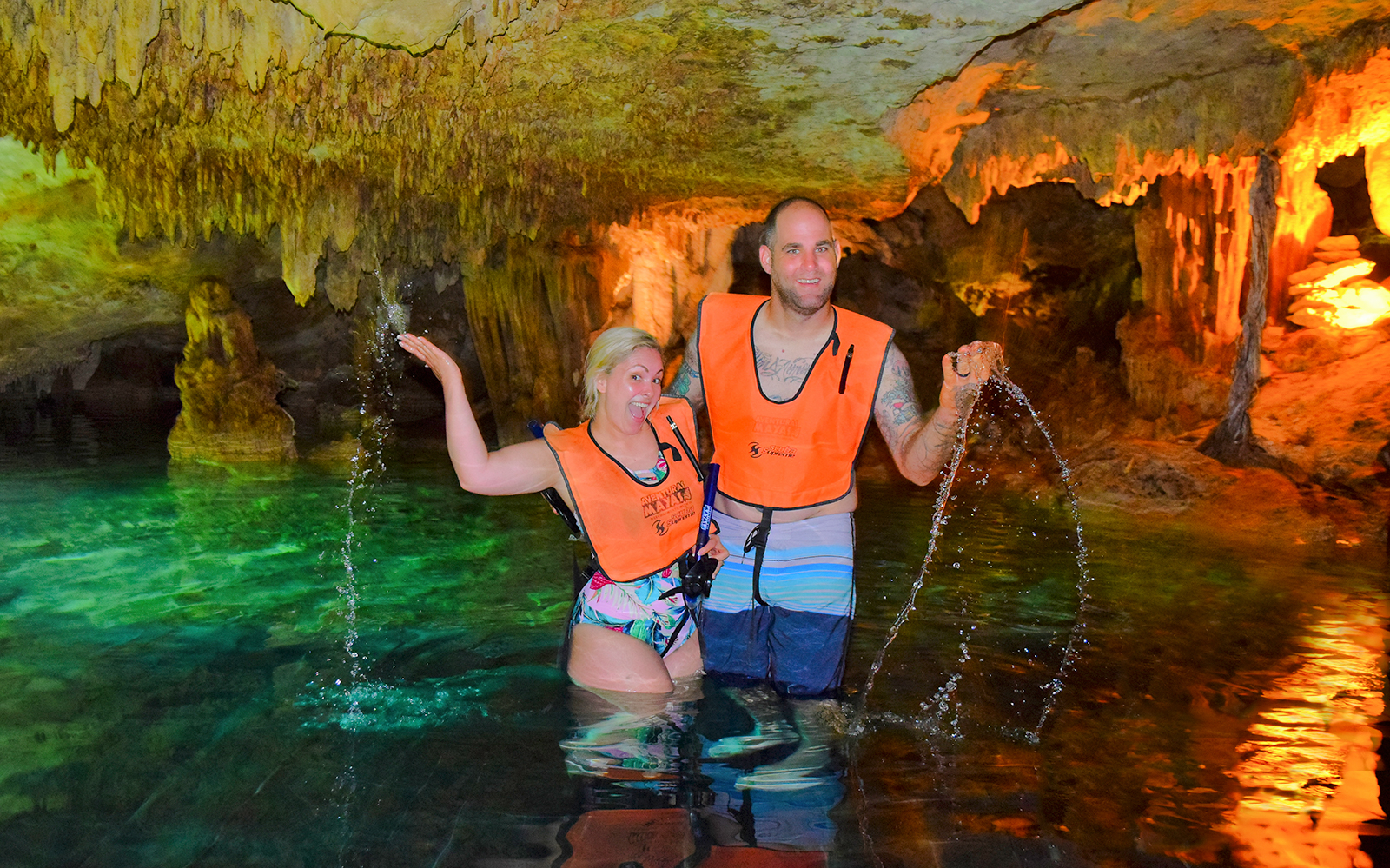 Couple enjoying a cenote swim during Cancun Snorkel & Zipline Xtreme Tour.