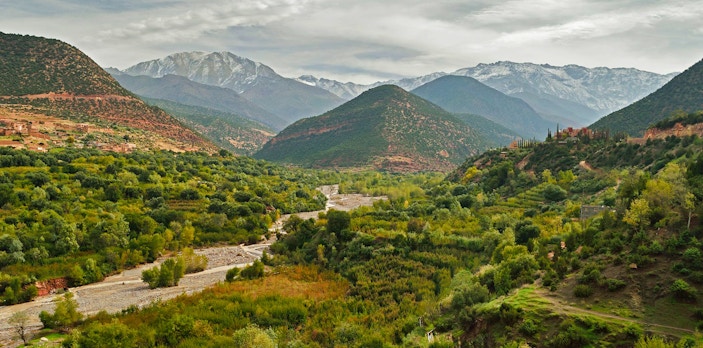 Ourika Valley lush landscape with Atlas Mountains in the background, Morocco.