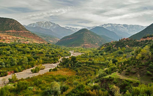 Ourika Valley lush landscape with Atlas Mountains in the background, Morocco.