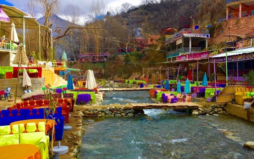 Colorful riverside cafes in Ourika Valley, Atlas Mountains, Morocco.